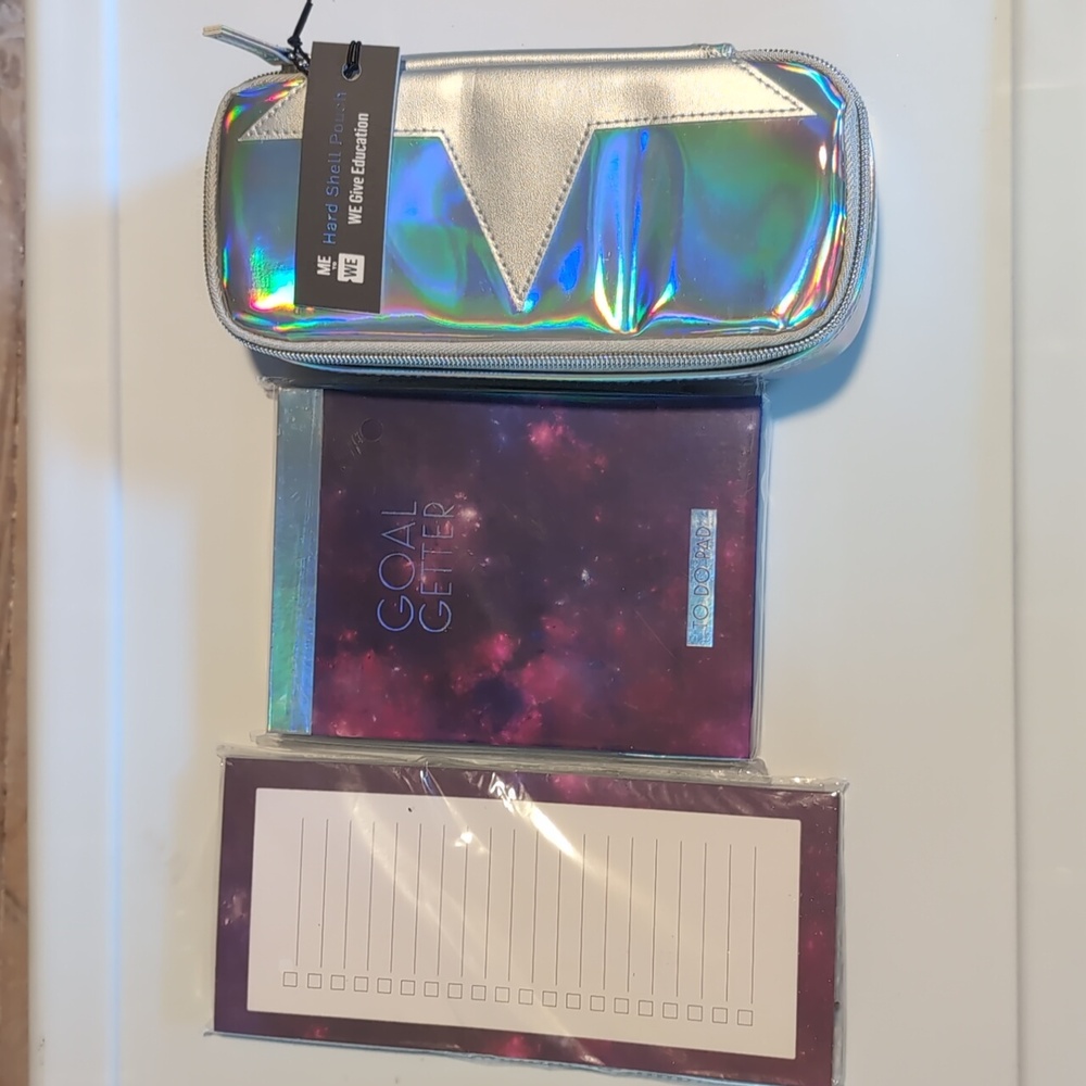 Me to We notepad and pencil pouch